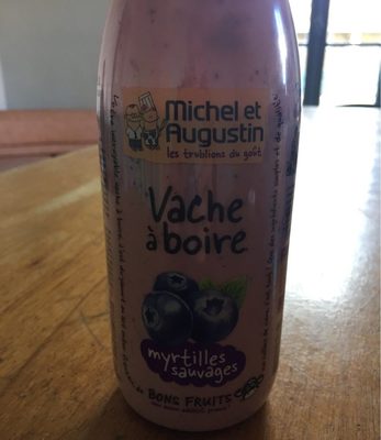 Vache a boire myrtilles sauvages