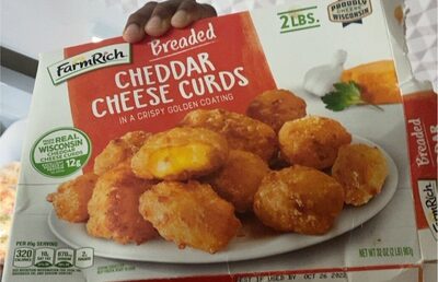 Breaded cheddar cheese curds in a crispy golden coating