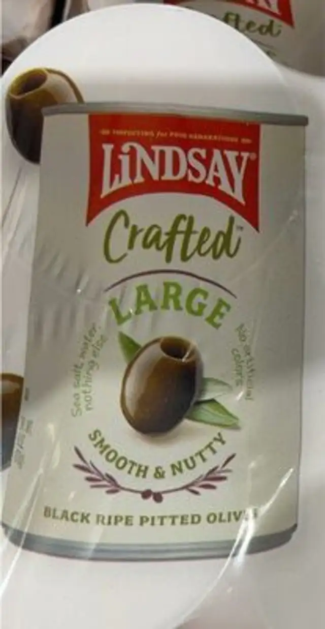 Crafted large black ripe pitted olives
