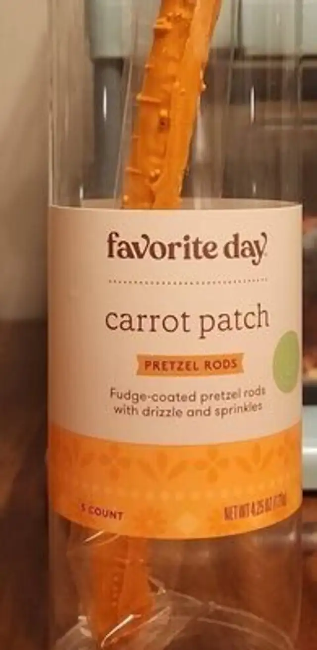 Carrot patch fudge coated pretzel rods with drizzle