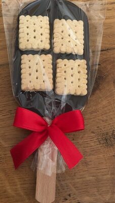 Sucette en chocolat noir avec petits biscuits