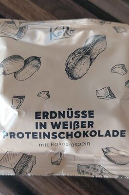 Erdnüsse in weißer Proteinschokolade mit Kokosraspeln