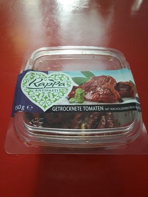 tomates séchées avec des baies de genièvre et d'herbes