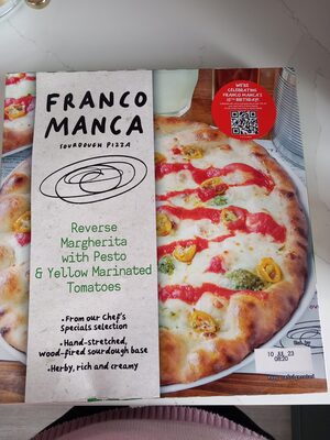 Reverse margarita with pesto and yellow marinated tomatoes sourdough pizza