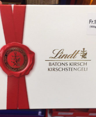 Sprüngli Batons de chocolat, fourrés au Kirsch liquide front packaging