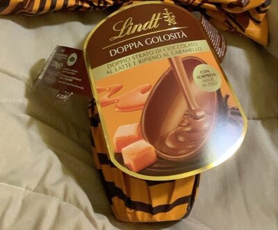 Uovo ciocclato al latte ripieno al caramello front packaging